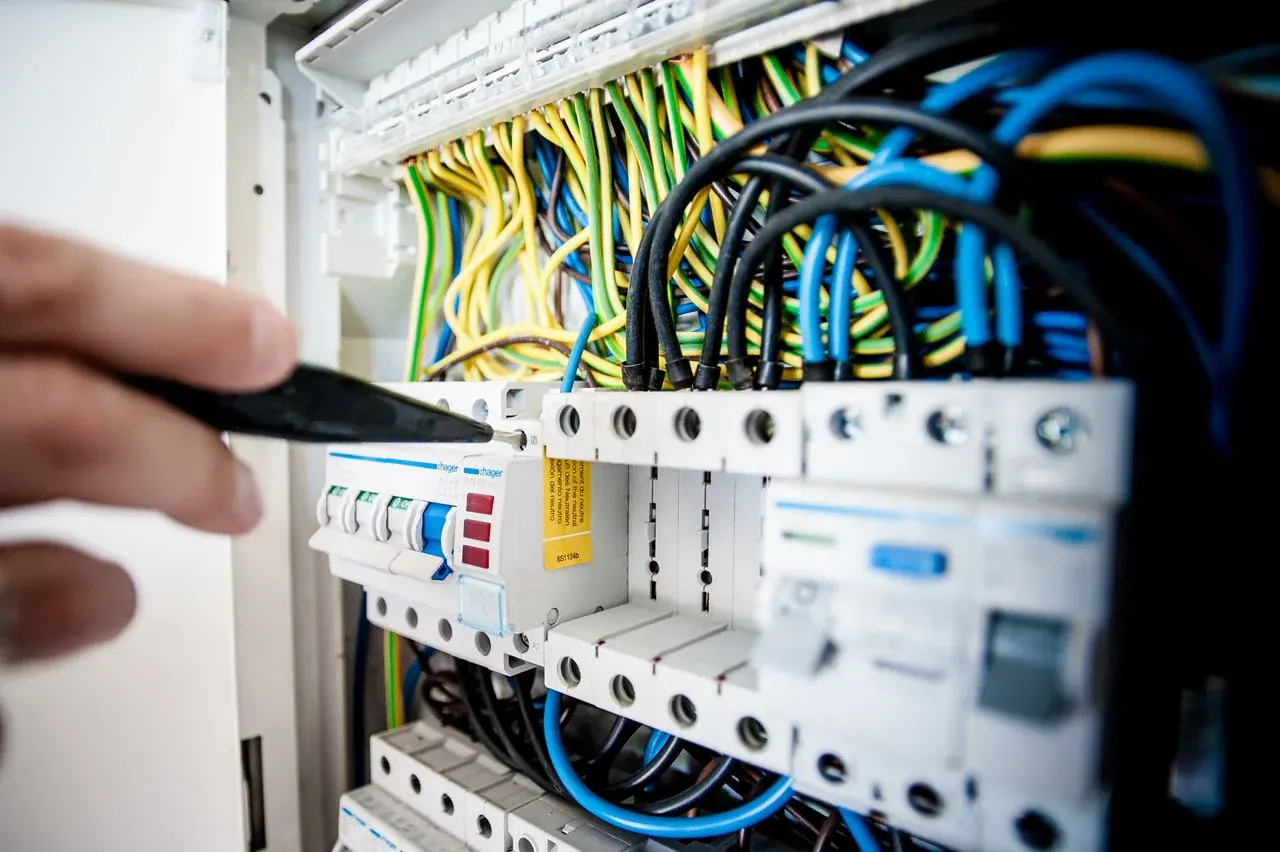 Electrician working on a circuit breaker panel